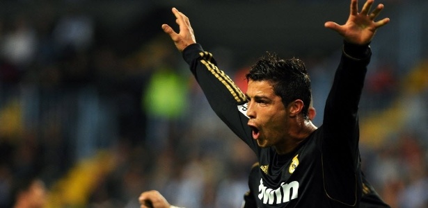 Português Cristiano Ronaldo marcou três gols na goleada sobre o Málaga - AFP PHOTO/ JORGE GUERRERO