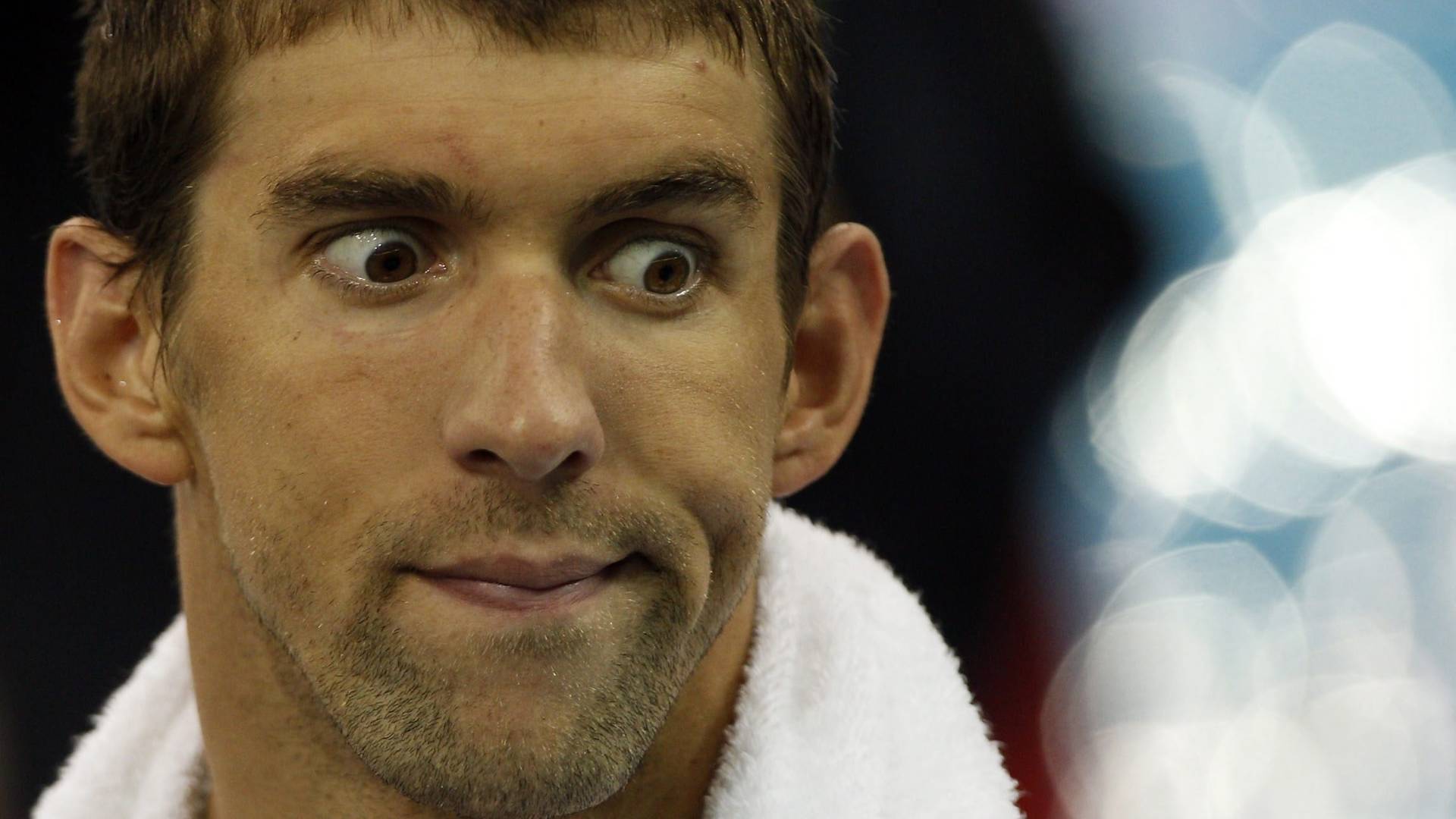 Michael Phelps faz careta durante treinamento para nadar o Mundial de Natação em Xangai (22/07/2011)