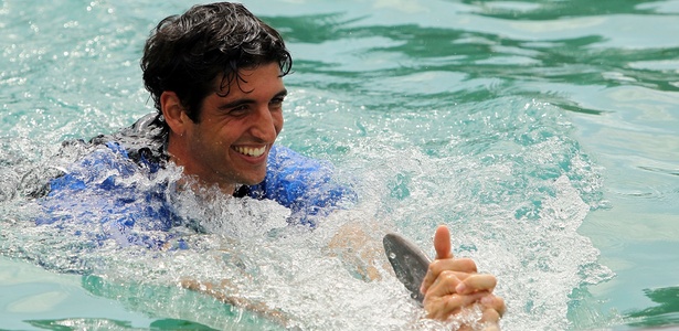Bellucci brincou com golfinhos em Miami no ano passado, agora diversão é o surfe - Chris McGrath/Getty Images