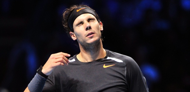 Rafael Nadal lamenta ponto perdido durante o duelo contra Jo-Wilfried Tsonga - AFP PHOTO / GLYN KIRK